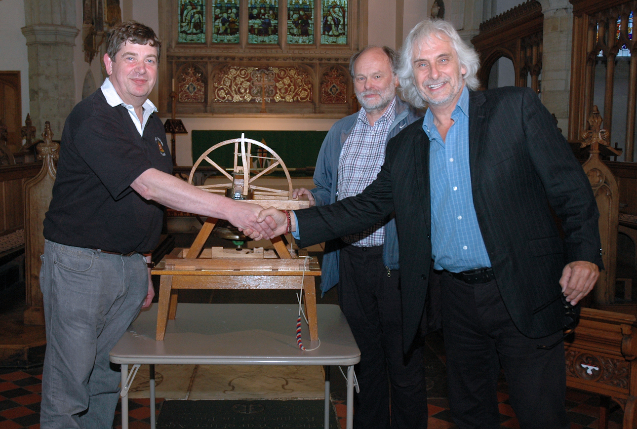 [Photograph of judges presenting trophy]